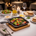 15cm cast iron square griddle pan with wooden base for cooking and serving hot sizzling dishes.