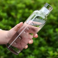 750ML glass water bottle with time scale, bamboo lid, and reusable glass straw for home, office, gym, and travel.