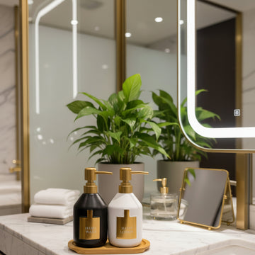 Bathroom counter with skincare products, towels, and a plant
