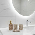 Luxury ceramic bathroom accessories set featuring an elegant textured leaf design with soap dispenser, tumbler, toothbrush holder, and tray.