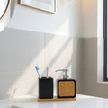 Modern bamboo bathroom accessories set with elegant soap dispenser, tumbler, and toothbrush holder for stylish bathroom organization.