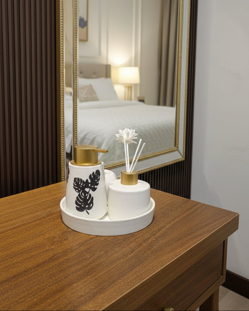 Bathroom accessories set with aroma diffuser, ceramic soap dispenser, tumbler, toothbrush holder, and vanity tray.