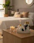 Ceramic bathroom vanity set with Monstera leaf design, soap dispenser, tumbler, toothbrush holder, and aroma diffuser.