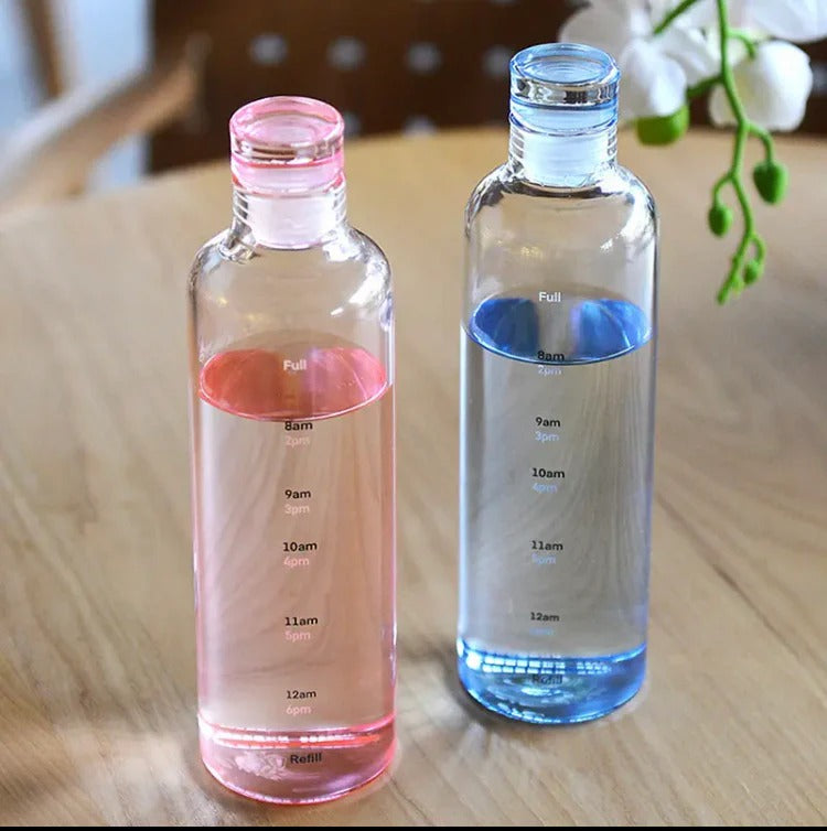 Elegant glass water bottle with bamboo lid, time scale, and eco-friendly reusable design for everyday use.