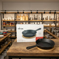 Premium mini cast iron skillet with bamboo serving base for restaurants, home kitchens, and food presentation.