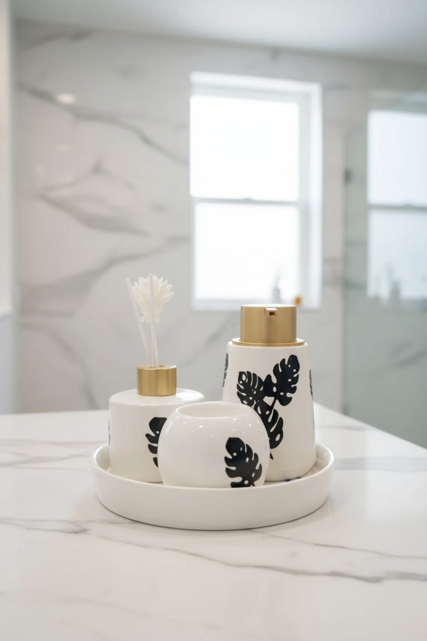 Modern Monstera ceramic bathroom organizer set with decorative vanity tray and premium bathroom accessories.