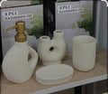 Luxury Nordic ceramic bathroom accessory set with matching soap dispenser, tumbler, toothbrush holder, and organizer tray.