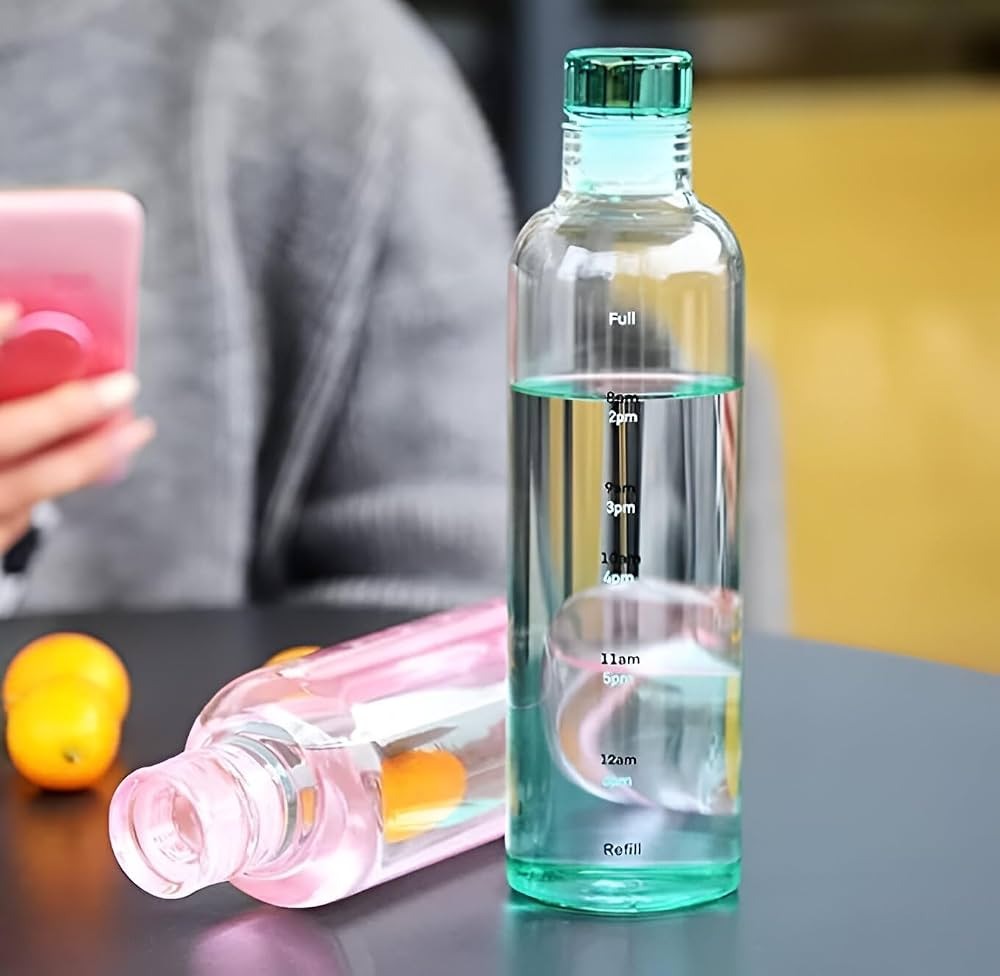 Motivational time marker glass water bottle with hourly measurement scale to help track daily water intake.