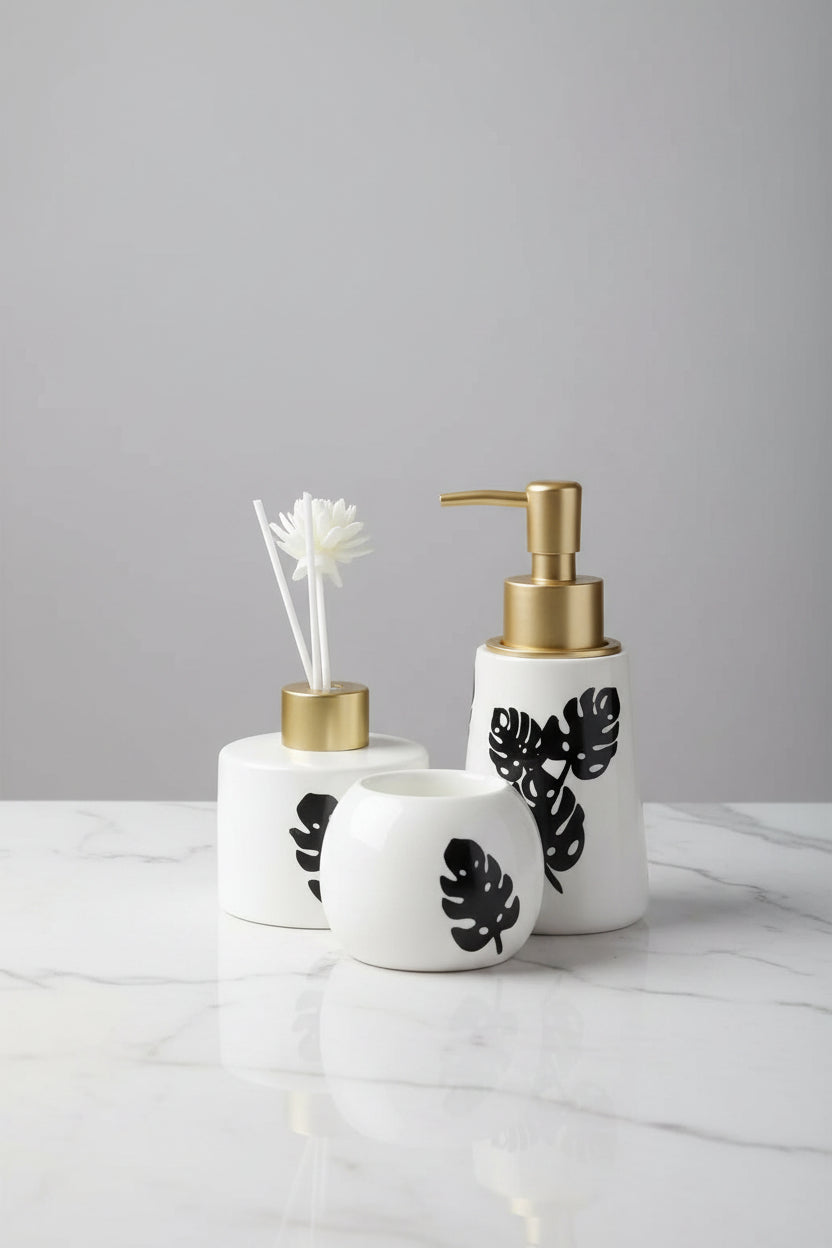 Modern Monstera ceramic bathroom organizer set with decorative vanity tray and premium bathroom accessories.